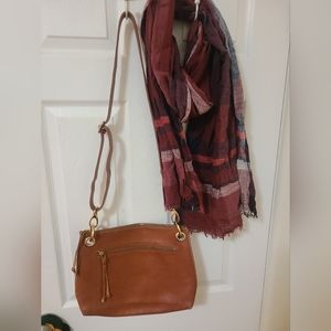 Roots Unlined leather crossbody bag.